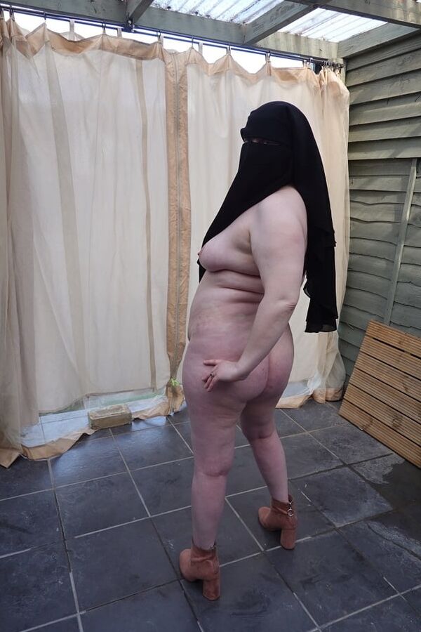 Nude in Niqab in ankle boots