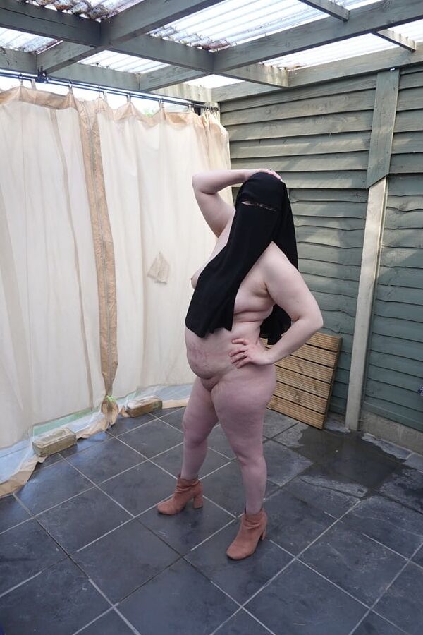 Nude in Niqab in ankle boots