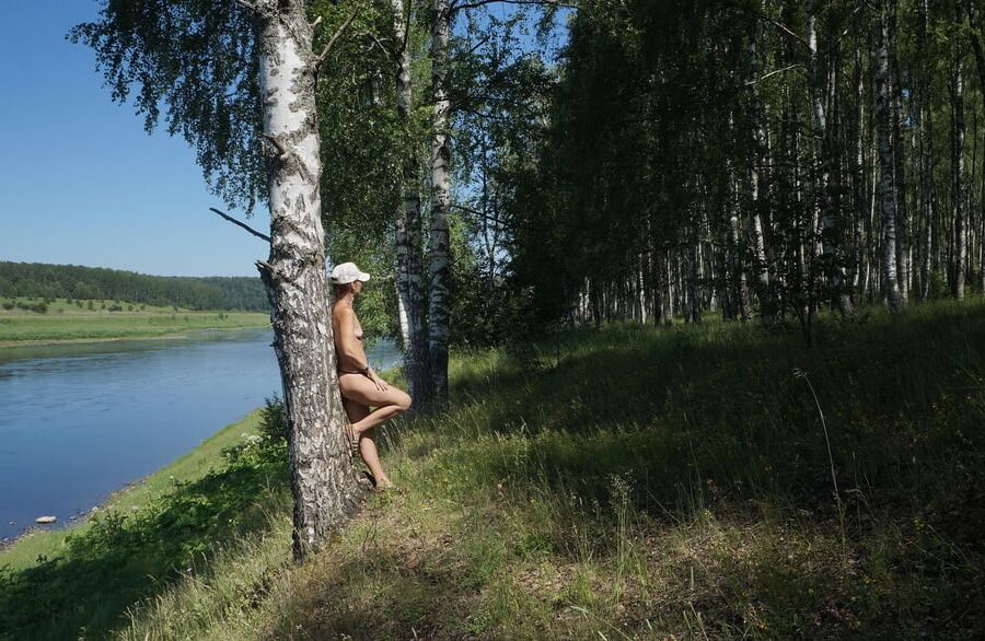 Nude near birch upon Volga