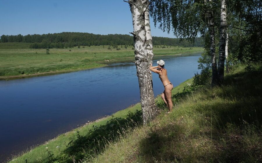 Nude near birch upon Volga