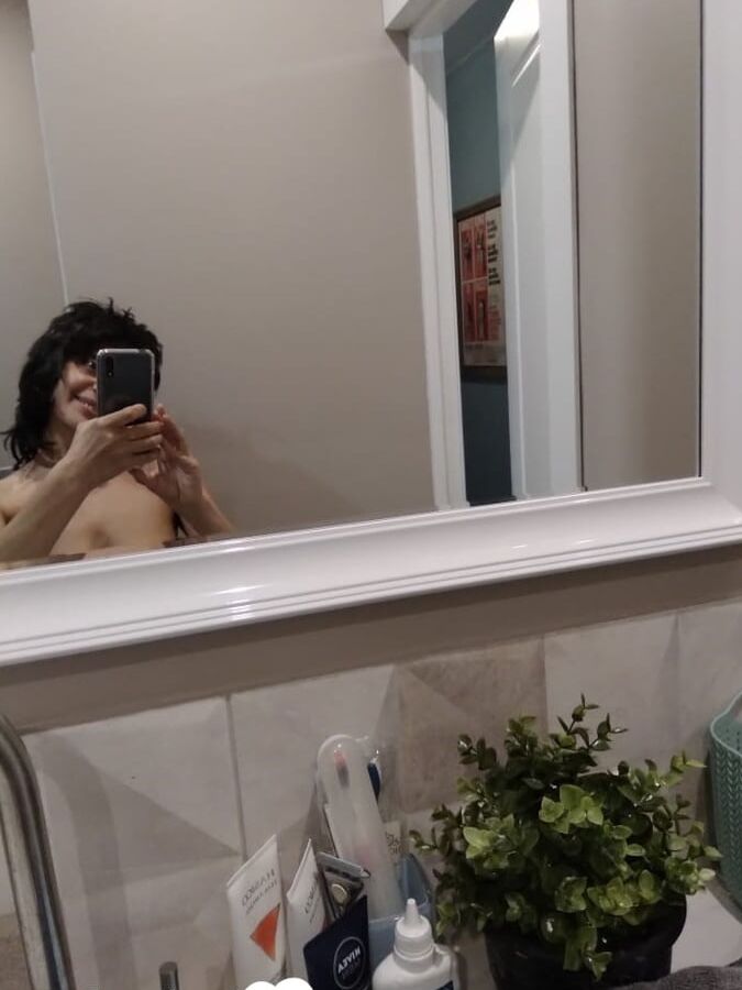 Short MILF with big tits loves to tease