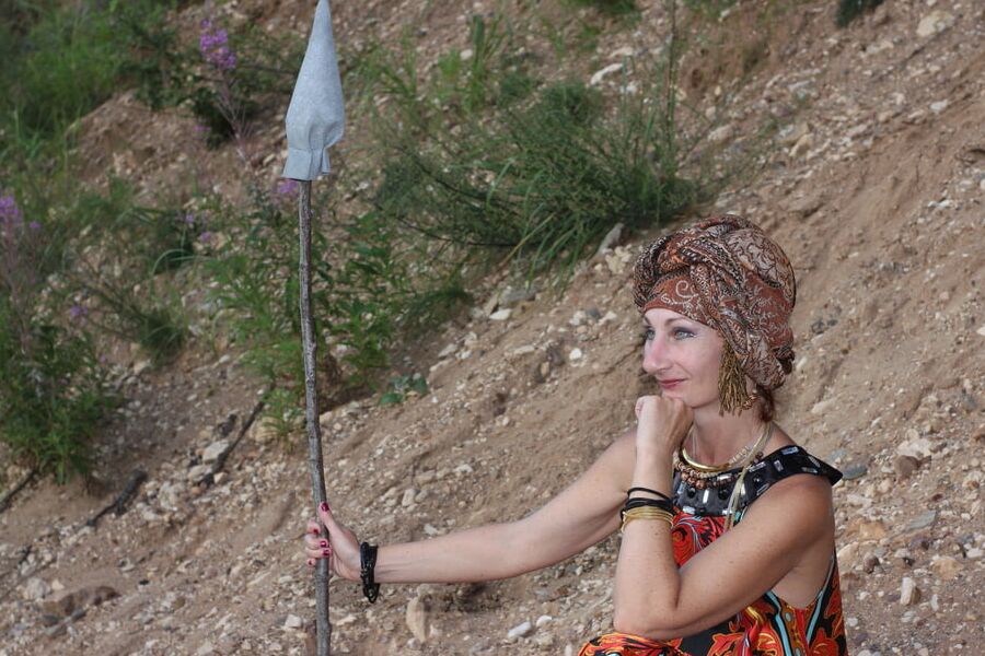 With Pear in Colorful Dress on Sand