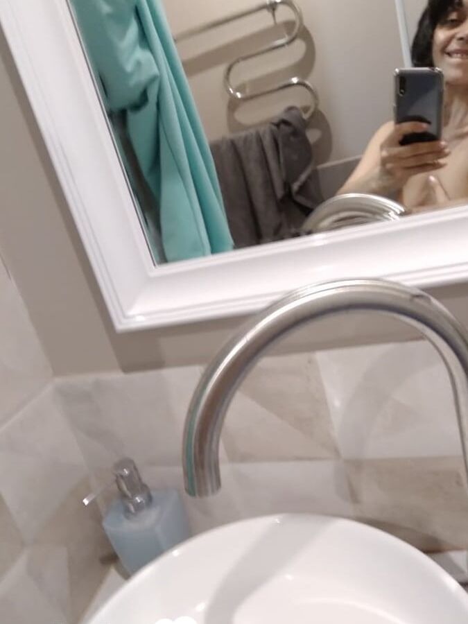 Short MILF with big tits loves to tease