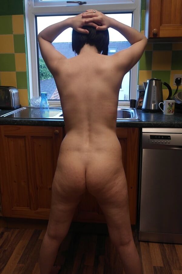 Posing nude in window