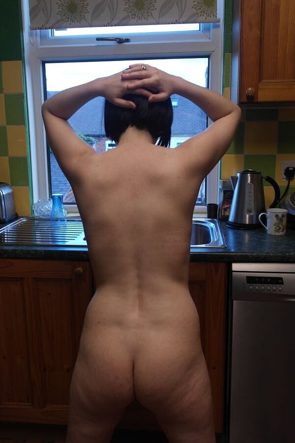 Posing nude in window