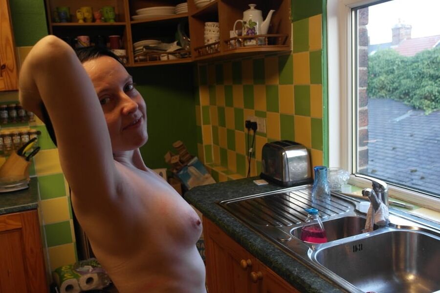 Posing nude in window
