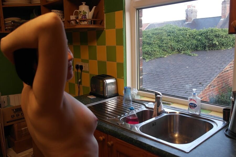 Posing nude in window