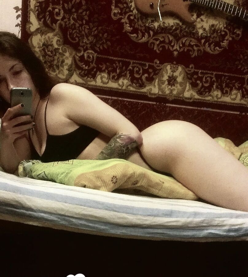 Brunette sweetie with a tattoo fools around