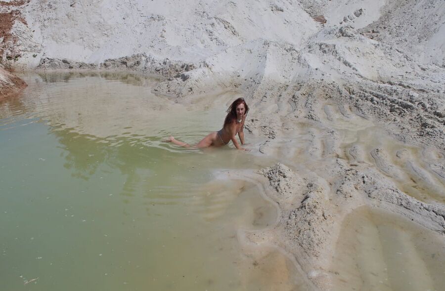 Bathing in white clay quarry
