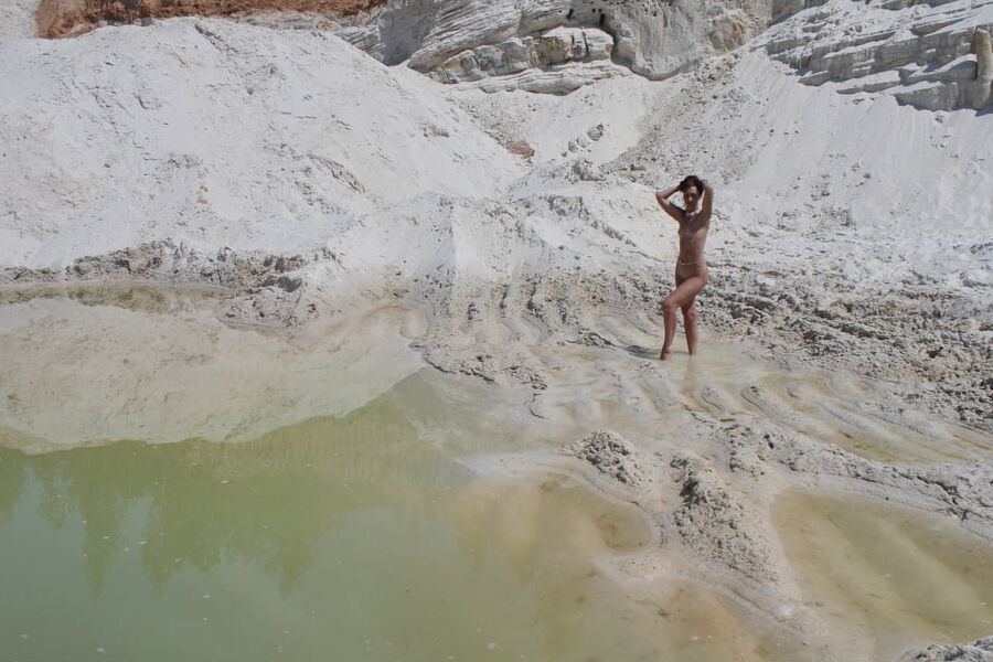 Bathing in white clay quarry