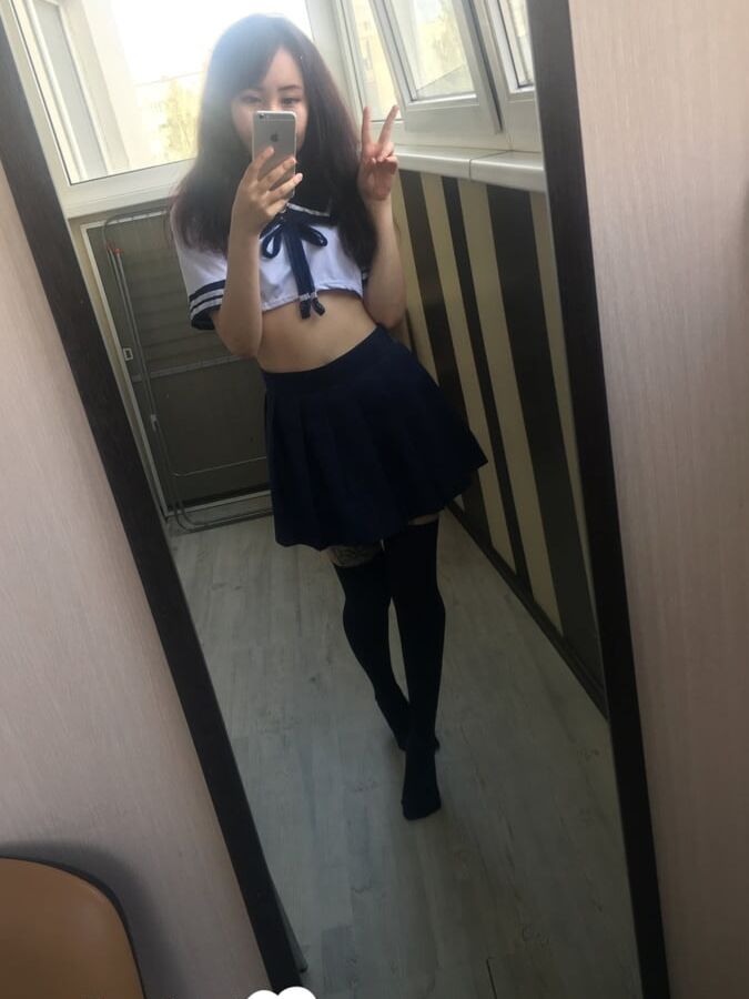 Asian schoolgirl flashing her pretty shaved pussy