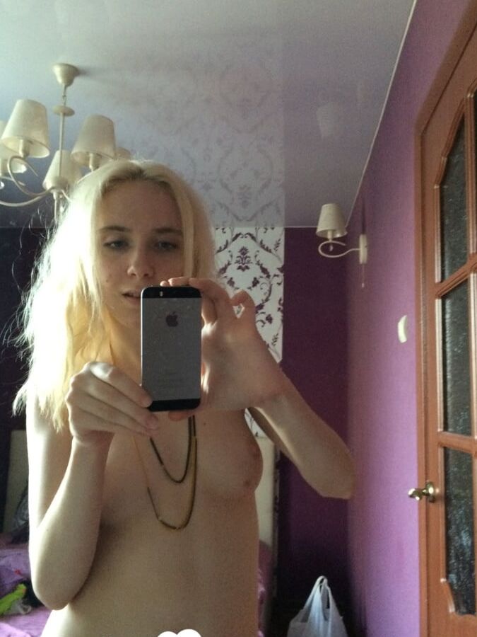 Skinny blonde cutie taking a couple of selfies