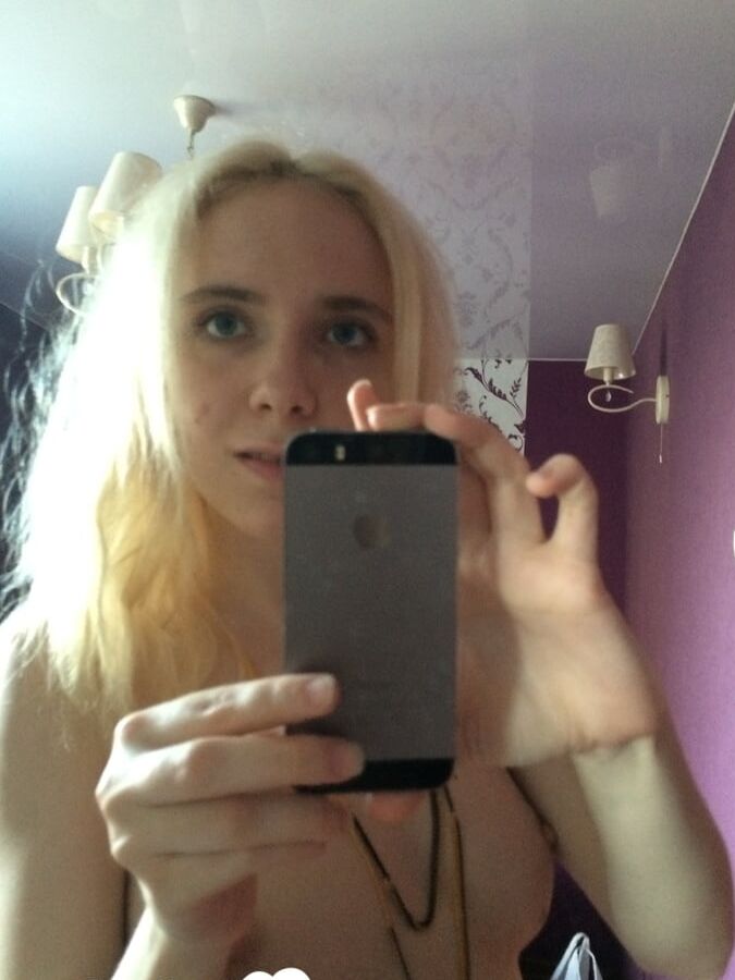 Skinny blonde cutie taking a couple of selfies