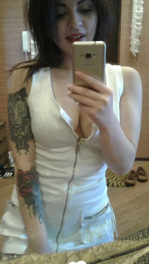 Tattooed beauty strips and shows off everything