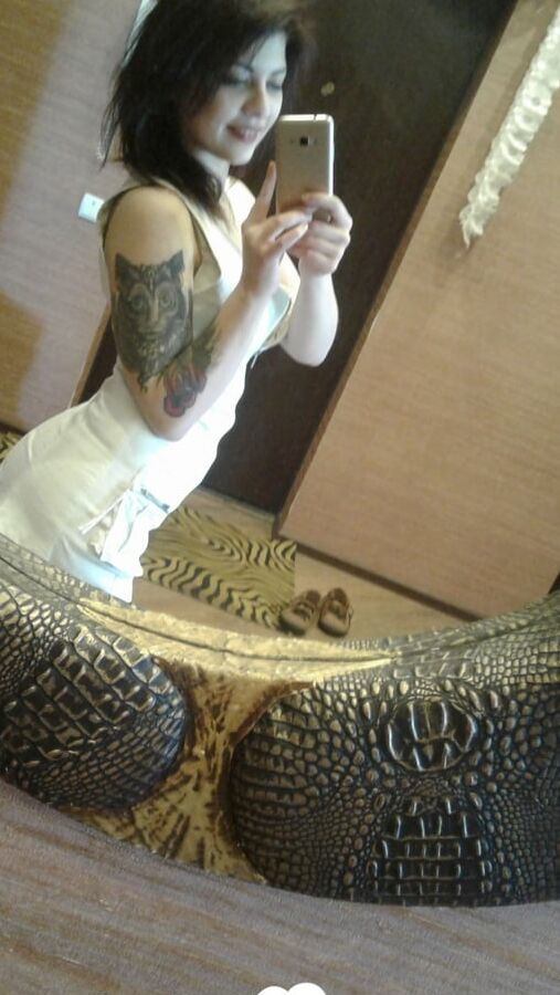Tattooed beauty strips and shows off everything
