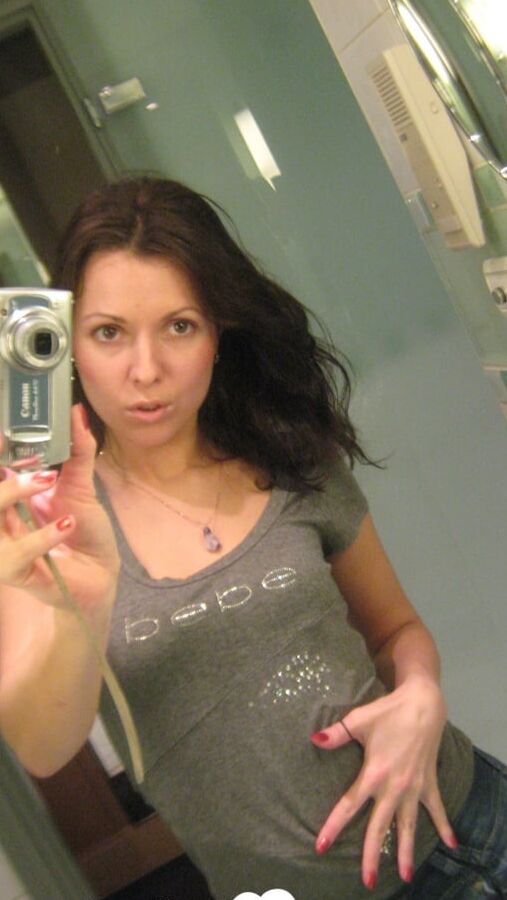 Innocent brunette teasing in her own bathroom