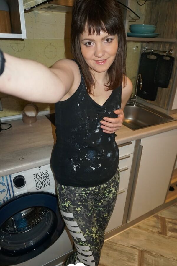 Brunette teen teasing in stockings in the bedroom