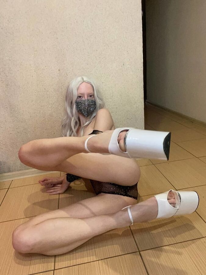 Sexy lady with long legs on high heels