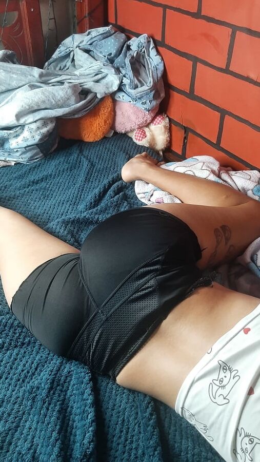 In bed posing for photos