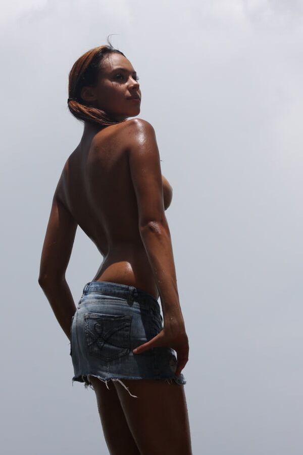 Cute tanned latina Gabrielle loves posing nude outdoors
