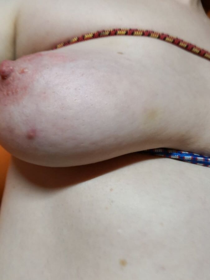 Tits bound with rubber rope