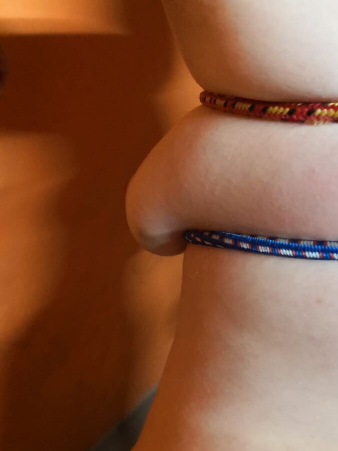 Tits bound with rubber rope