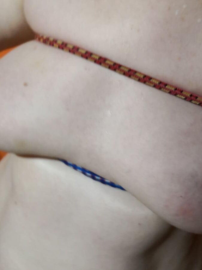 Tits bound with rubber rope