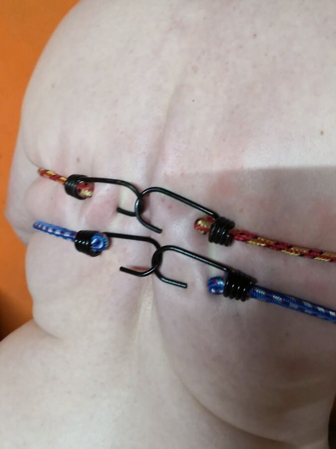 Tits bound with rubber rope
