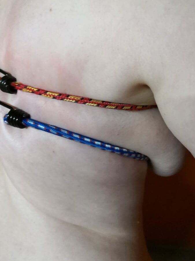 Tits bound with rubber rope