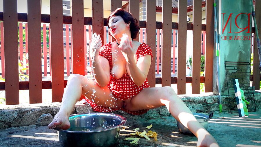 Retro maid prepares potatoes for dinner. Vintage performance