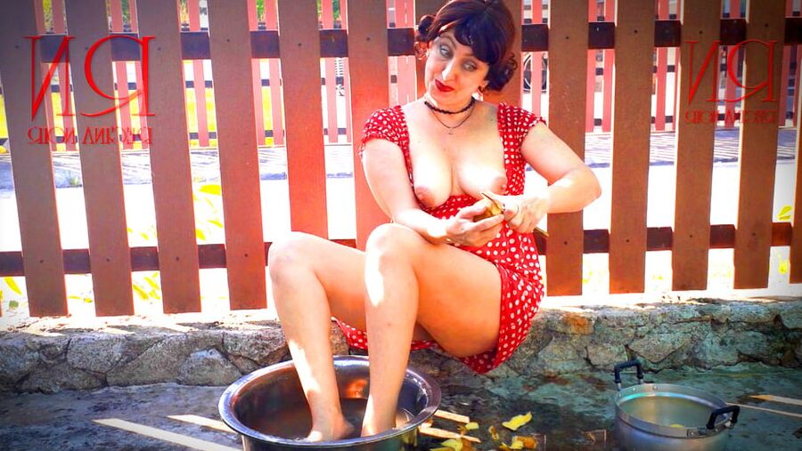 Retro maid prepares potatoes for dinner. Vintage performance