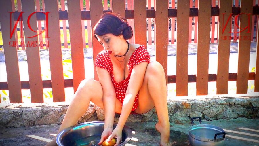 Retro maid prepares potatoes for dinner. Vintage performance