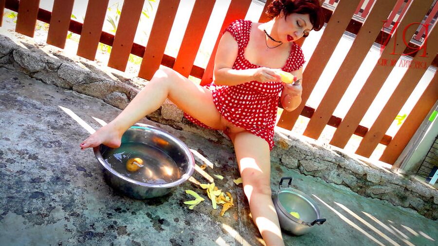 Retro maid prepares potatoes for dinner. Vintage performance