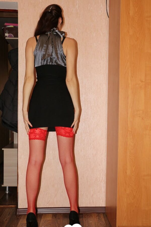 Hot amateur in red stockings using a dildo