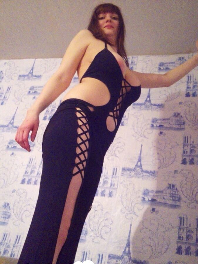 MILF in a seductive purple dress fooling around