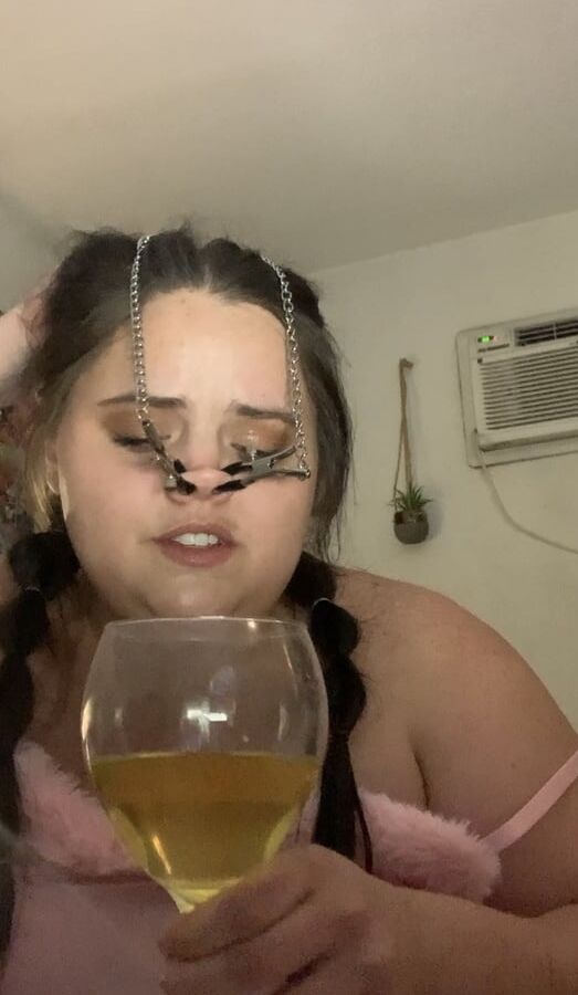Fat piggy squats over wine glass