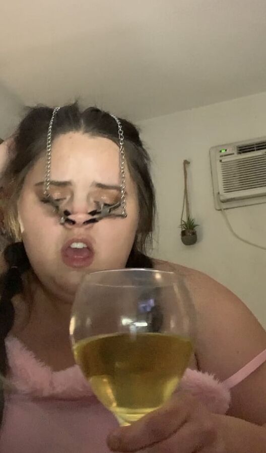 Fat piggy squats over wine glass