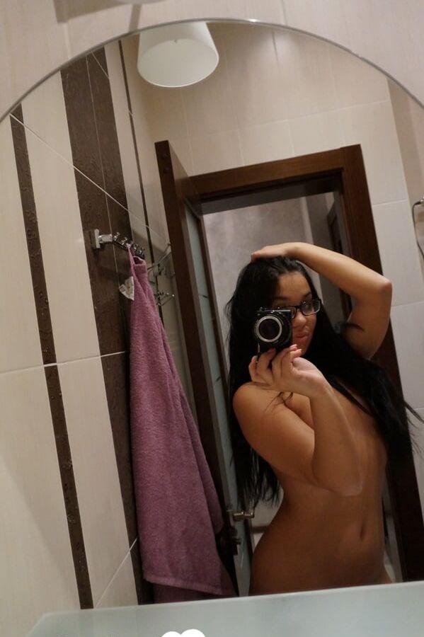 Cute nerdy babe taking some hot selfies