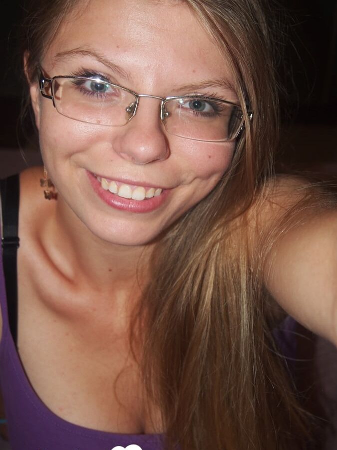Brunette teacher with glasses shows off her boobs