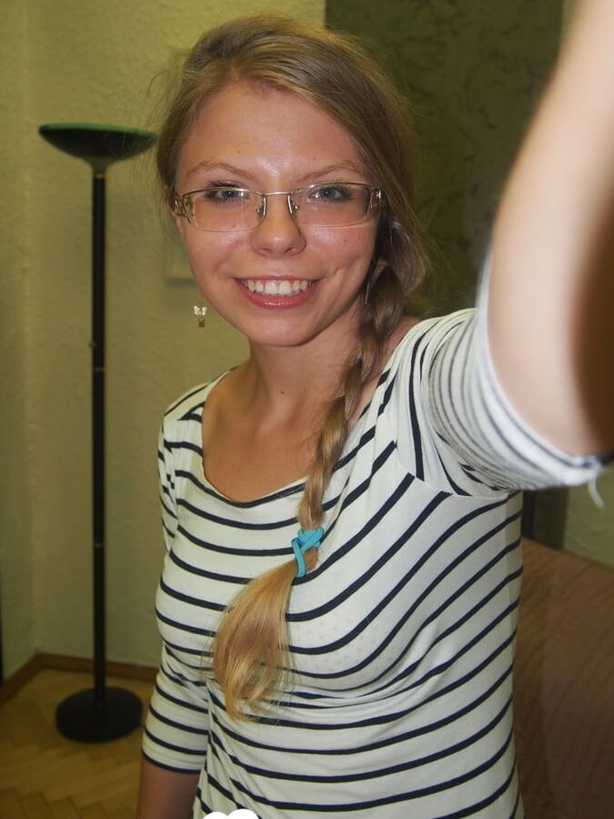 Brunette teacher with glasses shows off her boobs