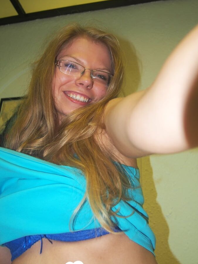 Brunette teacher with glasses shows off her boobs