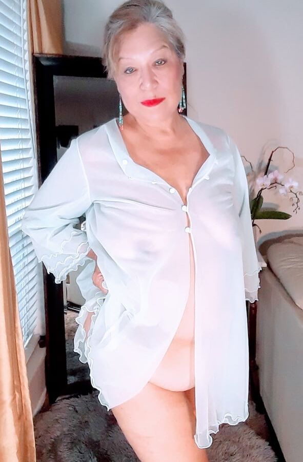 Mature bbw woman in a transparent night gown
