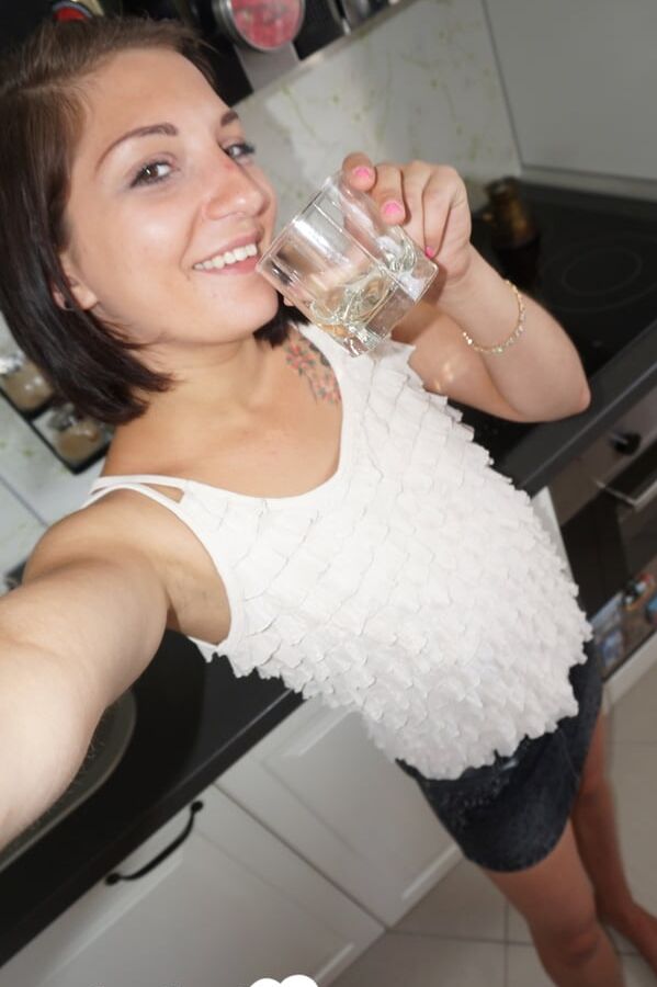 Brunette wears white gloves while showing her boobs