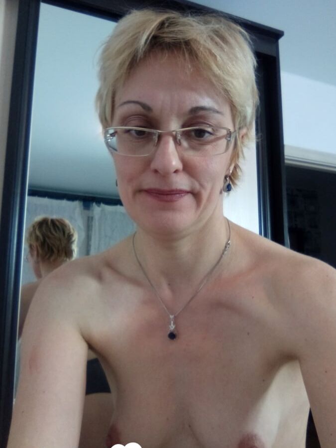 Stunning MILF puts on a yellow dress