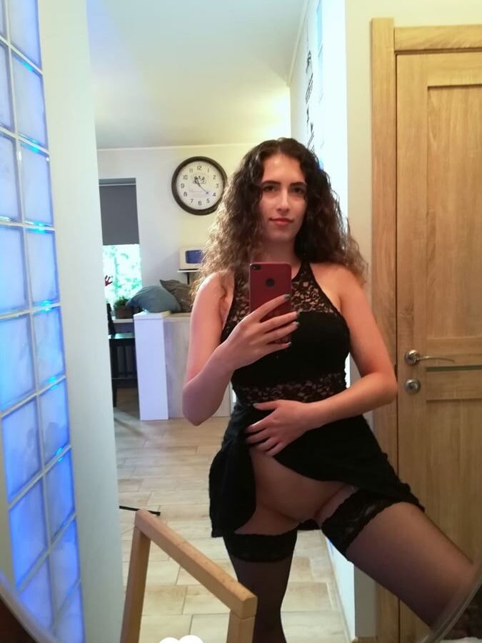 Kinky cutie trying on some black lingerie