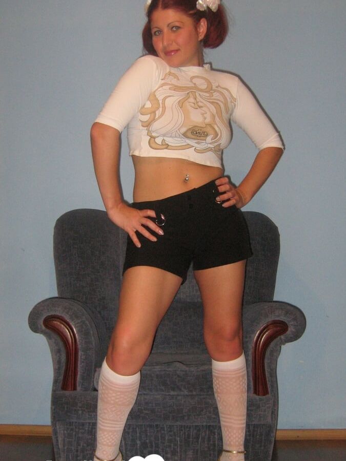 Flexible teen in knee socks uses a toy