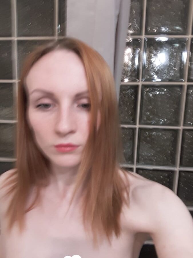 Skinny redhead with small tits in the mirror