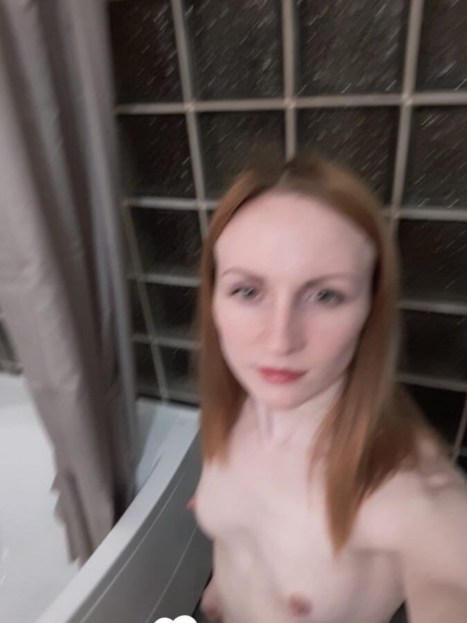 Skinny redhead with small tits in the mirror