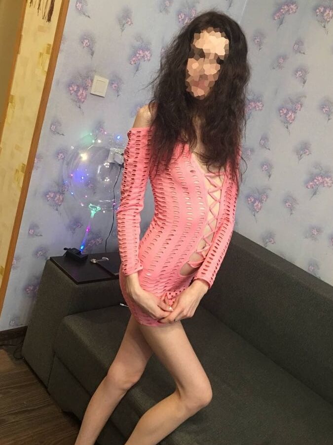 Slim beauty in pink dress