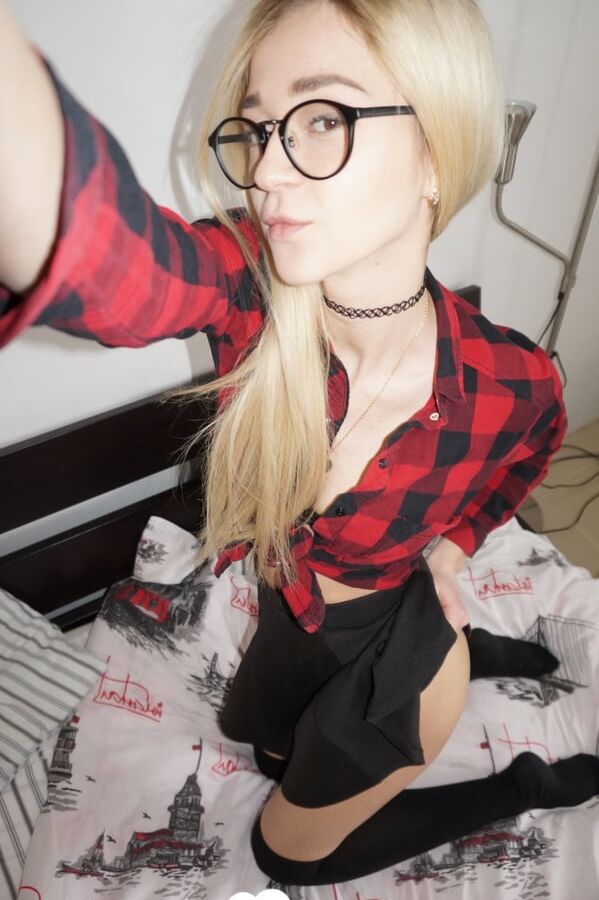 Naughty nerdy schoolgirl strips off her uniform
